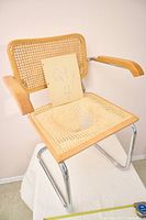 front view of one cane chrome cantilever armchair with quantity note