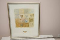 Full view of framed print showing artwork, mat and silver frame