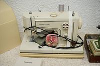 Kenmore sewing machine with accessories and case