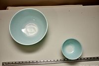 Both aqua/turquoise bowls top view with ruler for scale