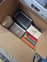 Top view of open box showing several German hardcover books