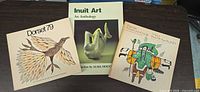 Front covers of all three Inuit art softcover books