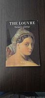 Front cover of paperback book The Louvre: European Paintings