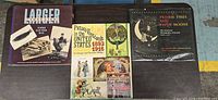 Front covers of all three postcard history books