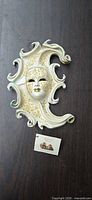 Full view of Venetian wall mask showing design and coloration