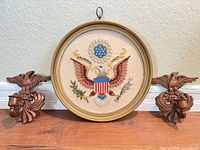 Framed embroidery with pair of eagle candle holders