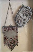 Front view of mesh purse, beaded purse displayed in shadowbox