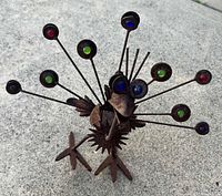 Front angled view of entire metal bird sculpture