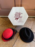 Two felt hats and hexagonal Village Hat Shop box