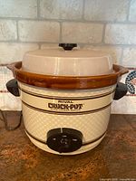 Front view of Rival Crock-Pot showing housing, lid, handles