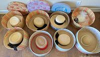 Eight straw hats in open round hat boxes plus bridal headpiece