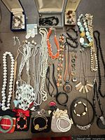 Overview of mixed women’s costume jewelry pieces laid out on surface