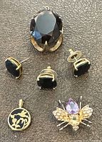 All five jewellery pieces laid out