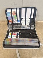 Overall view of open Artist’s Loft kit showing contents in case