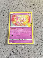 Front view of sleeved Mew Celebrations holographic card showing details