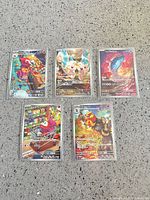 Group shot of all five sleeved AR cards