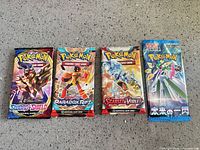 Front view of all four sealed booster packs