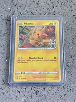 Front of Pikachu snowflake stamped card in toploader