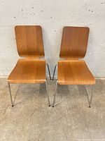 Both chairs front view showing design and condition