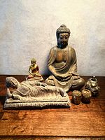 Group shot of all five Buddha items