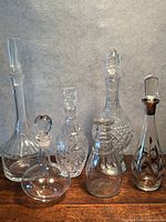Group view of six glass/crystal decanters