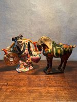 Both figurines side by side