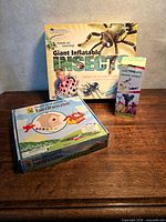 Lot overview showing three boxed items on table