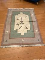 Full view of rug showing overall pattern and borders