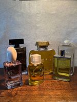 Front view of six large perfume display bottles