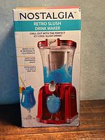 Front of boxed Nostalgia Retro Slush Drink Maker