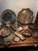 Group view of all silver-plated trays and dishes
