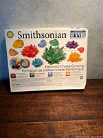 Front of Smithsonian Electronic Crystal Growing Kit box showing branding and crystal images