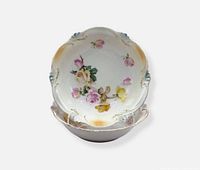 Top view of stacked hand-painted floral porcelain bowls