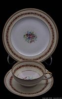 Cup, saucer and dessert plate front displaying pattern and sizes