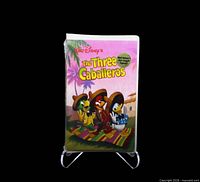 Front view of sealed Disney The Three Caballeros VHS tape on stand