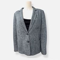 Full front view of blue knit blazer on mannequin