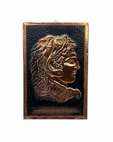 Front view showing entire copper bas-relief plaque and hanging loop