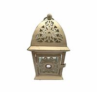 Front view of beige metal lantern, door closed