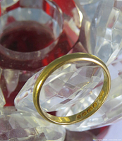 Plain gold band with interior hallmark stamps
