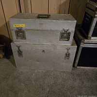 Two stacked ARRI diamond-plate aluminum trunks showing overall form and hardware