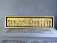 Full view of framed relief panel on wall