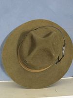 Front view of olive wool campaign hat showing crown dents and brim