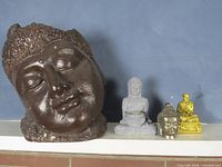 All four figurines on shelf