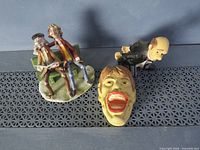 All three resin figurines showing condition and style