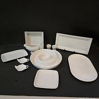 Group shot of all eleven white porcelain pieces