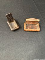 Both wooden boxes opened to show interiors and hinged lids