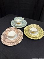 All three porcelain tea trios displayed to show colors and matching pieces