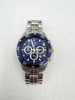 Front view showing blue dial, subdials, bezel and bracelet