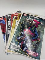Stack of four bagged Spider-Man comics, front cover American Son #2