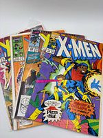 Stack of five bagged X-Men comics showing front covers